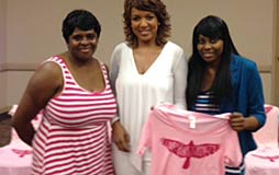 Canetta shows off her T-shirt Design on Romona's Kids with Romona Robinson (center) and her mother Donna Wilburn (left).