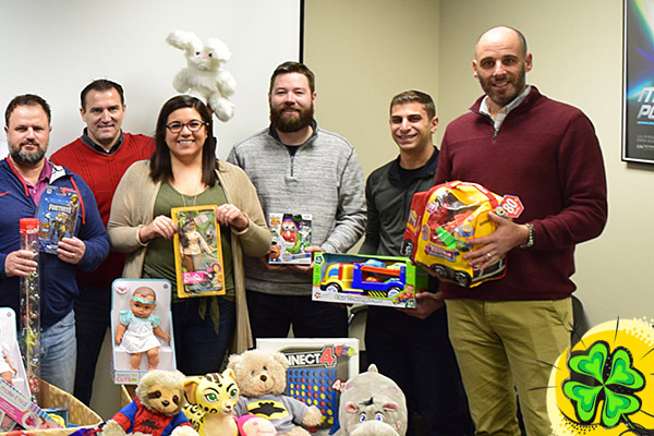 Direct Recruiters, Inc. & Direct Consulting Associates staff with toy donations